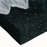 Close-up of a vibrant stretched canvas wall art piece depicting a serene beach landscape, featuring soft pastel colors and gentle waves, perfect for coastal decor.