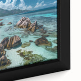 Framed canvas showcasing a vibrant beach landscape, featuring soft waves and a serene sunset, perfect for adding a tranquil touch to home decor.