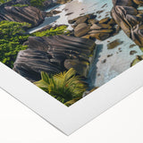 Vibrant rolled canvas wall art showcasing a serene beach landscape with golden sands and turquoise waves, elegantly packaged in a protective cardboard tube.