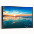 Framed canvas wall art showcasing a serene beach landscape design, featuring vibrant blues and sandy tones, viewed from the side against a neutral background. Ideal for coastal-themed decor.