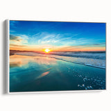 Framed canvas wall art showcasing a serene beach landscape with vibrant blue skies and gentle waves, presented in a sleek white frame. Ideal for coastal decor.