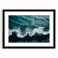 Framed wall art featuring a serene beach landscape design, showcasing soft waves and a vibrant sunset; presented in a sleek black frame with a mat for an elegant finish. Ideal for adding a tranquil touch to home decor.