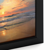 Framed canvas wall art featuring a vibrant beach landscape design, showcasing blue ocean waves, golden sand, and a clear sky, perfect for coastal decor.