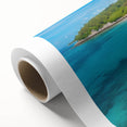 Rolled canvas art showcasing a vibrant beach landscape with soft waves and a sunset backdrop, elegantly packaged in a protective cardboard tube for easy display.