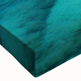 Close-up view of a vibrant stretched canvas wall art piece showcasing a beach landscape design, featuring vivid colors and intricate details, perfect for home decor.