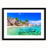 Framed wall art collection showcasing serene beach landscapes in a sleek black frame with a white mat, ideal for coastal-themed home decor.