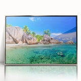 Framed wall art collection showcasing a serene beach landscape in soft blues and sandy tones, designed with a sleek silver frame for modern decor.