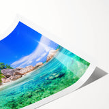 Vibrant rolled print of a serene beach landscape featuring soft blue waters and golden sands, ideal for home decor, packaged securely in a cardboard tube.
