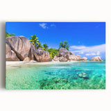 Stretched canvas wall art depicting a serene beach landscape at sunset, featuring vibrant colors of orange and pink in the sky, perfect for coastal decor.