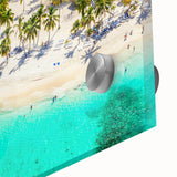 Close-up of a vibrant acrylic glass wall art piece showcasing a serene beach landscape with soft waves, golden sand, and a clear blue sky, ideal for coastal decor.
