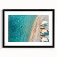 Framed black wall art featuring a serene beach landscape with vibrant colors, ideal for home decor, showcasing a calming ocean view with a mat for added elegance.