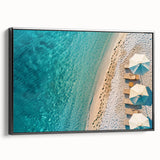Framed canvas wall art showcasing a serene beach landscape design, featuring soft blue and beige tones, presented in a sleek black frame for modern decor. Ideal for enhancing coastal-themed interiors.