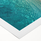 Vibrant rolled canvas wall art featuring a serene beach landscape with golden sands and turquoise waves, ideal for enhancing coastal-themed decor.