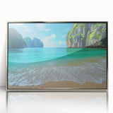 Framed wall art design showcasing a serene beach landscape with vibrant colors, featuring a silver frame that enhances the visual appeal, perfect for home decor.