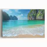 Stretched canvas wall art depicting a serene beach landscape at sunset, showcasing vibrant hues of orange and blue, perfect for coastal-themed decor.