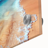 Close-up of a vibrant acrylic glass wall art piece showcasing a serene beach landscape, featuring crystal-clear water and soft sandy shores, perfect for coastal decor.