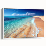 Framed canvas wall art showcasing a serene beach landscape, featuring soft blue and beige tones, displayed in a white frame, ideal for coastal-themed decor.