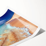 Vibrant beach landscape wall art print showcasing vivid sunset colors and serene ocean waves, rolled for easy display and transport, ideal for coastal decor enthusiasts.