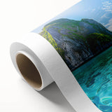 Vibrant rolled canvas artwork showcasing a serene beach landscape at sunset, featuring warm hues of orange and pink, ideal for home decor and relaxation ambiance.