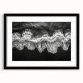 Framed wall art featuring a serene beach landscape, showcased in a sleek black frame with a white mat, ideal for coastal-themed home decor. Perfect for adding a calming aesthetic to living spaces.