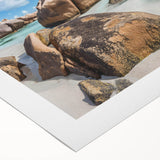 Vibrant rolled canvas art showcasing a serene beach landscape with vivid blues and soft sands, designed to enhance home decor and create a tranquil atmosphere.