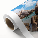 Vibrant rolled canvas wall art showcasing a serene beach landscape with gentle waves and a pastel sunset, ideal for home decor or relaxation spaces.