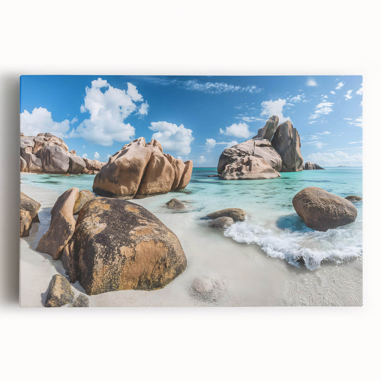 Stretched canvas artwork showcasing a serene beach landscape with vibrant blue skies and soft white clouds, perfect for enhancing coastal-themed decor or relaxation spaces.