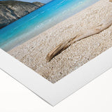 Vibrant rolled canvas wall art showcasing a serene beach landscape with soft waves and golden sand, perfect for coastal home decor.