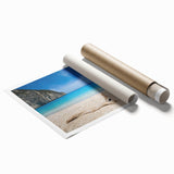 Vibrant rolled print showcasing a serene beach landscape with soft pastel colors, ideal for home décor. Packaged securely in a durable cardboard tube for protection.