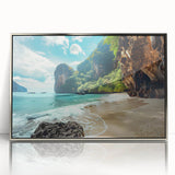 Framed wall art showcasing a serene beach landscape with vibrant sunset colors, elegantly displayed in a sleek silver frame, perfect for home decor enhancement.