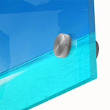 Close-up of a vibrant acrylic glass wall art piece showcasing a serene beach landscape with soft waves and a colorful sunset, ideal for coastal-themed decor.