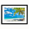 Framed wall art featuring a serene beach landscape with vibrant colors, set in a sleek black frame with a mat, ideal for coastal-themed decor.