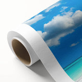Vibrant rolled canvas print showcasing a serene beach landscape with golden sands and turquoise waves, ideal for enhancing home decor and creating a tranquil ambiance.