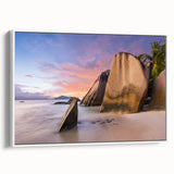 Framed canvas wall art showcasing a serene beach landscape with soft blue hues and gentle waves, perfect for coastal-themed home decor. The piece is elegantly presented in a white frame, adding a modern touch to any room.