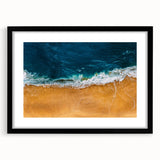 Framed wall art featuring a serene beach landscape with vibrant colors, set in a sleek black frame and mat, perfect for home decor and coastal themes.