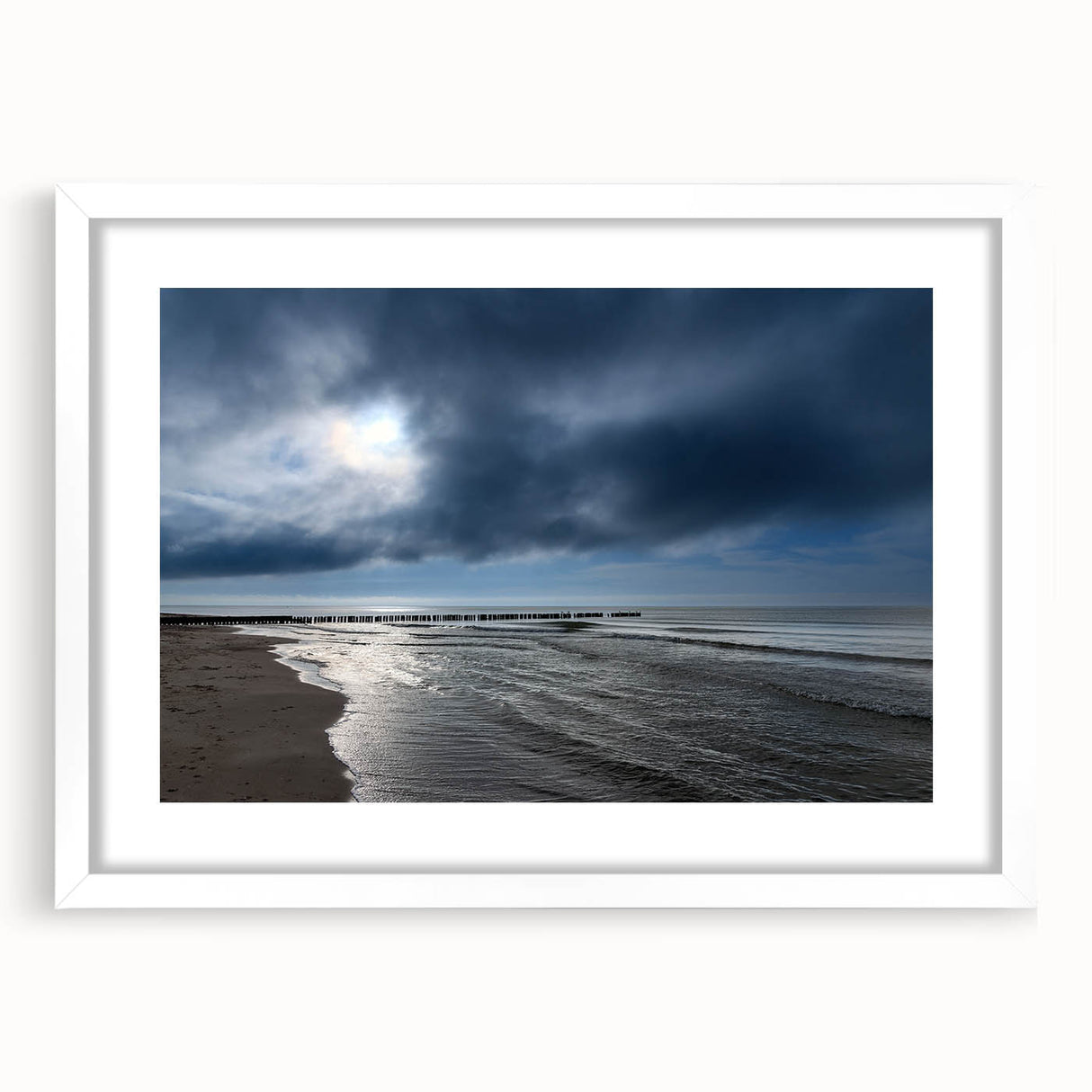 Framed wall art design showcasing a serene beach landscape with soft, calming colors, elegantly matted in white, ideal for home decor and relaxation.