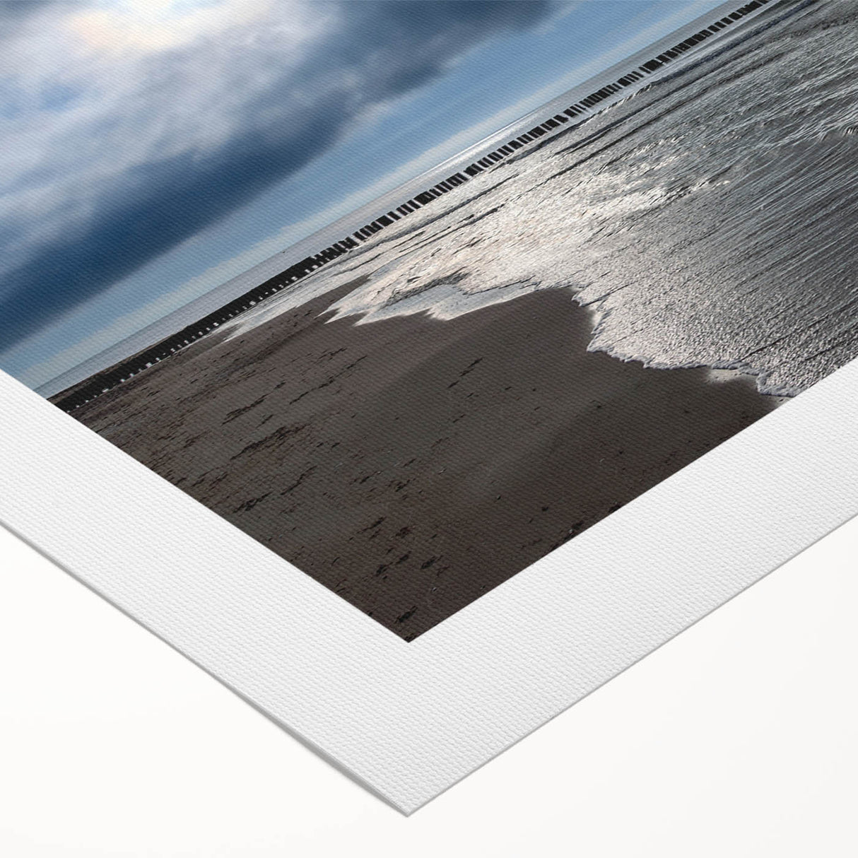 Vibrant rolled canvas wall art showcasing a serene beach landscape at sunset, featuring soft pastel colors and gentle waves, perfect for home decor.