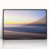 Framed wall art collection displaying a vibrant beach landscape scene with blue skies and golden sand, set in a sleek black frame for modern decor.