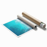 Stunning rolled print of a serene beach landscape showcasing vibrant turquoise waters and soft golden sands, perfect for enhancing any coastal-themed decor.