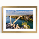 Framed wall art showcasing a vibrant landscape bridge design with a gold matting, perfect for enhancing modern home decor. Ideal for living rooms or offices.
