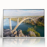 Framed acrylic wall art featuring a serene landscape with a bridge, designed for modern decor. The artwork showcases vibrant colors and intricate details, perfect for enhancing living spaces.