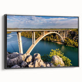 Framed canvas wall art depicting a serene landscape with a bridge, showcasing rich colors and intricate details. Ideal for modern home decor, this piece adds elegance and tranquility to any space.