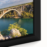 Framed canvas artwork showcasing a vibrant landscape bridge design, featuring rich colors and intricate details, perfect for enhancing home decor.