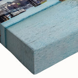 Close-up of a stretched canvas wall art featuring a vibrant landscape design with a bridge, showcasing rich colors and intricate details, perfect for home decor.