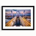 Framed wall art showcasing a modern landscape bridge design, featuring a sleek black frame and white matting, ideal for contemporary home decor.