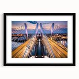 Framed wall art showcasing a modern landscape bridge design, featuring a sleek black frame and white matting, ideal for contemporary home decor.