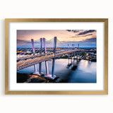 Framed landscape wall art featuring a scenic bridge design with a gold mat, elegantly showcased in a modern interior. Ideal for enhancing home decor.