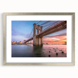 Framed wall art featuring a silver mat showcasing a vibrant landscape and bridge design, perfect for home decor, adding a modern touch to any room.