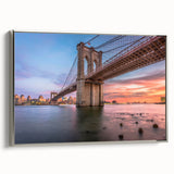 Framed canvas of a serene landscape featuring a bridge over a calm river, with lush greenery and a silver frame, perfect for enhancing home decor.