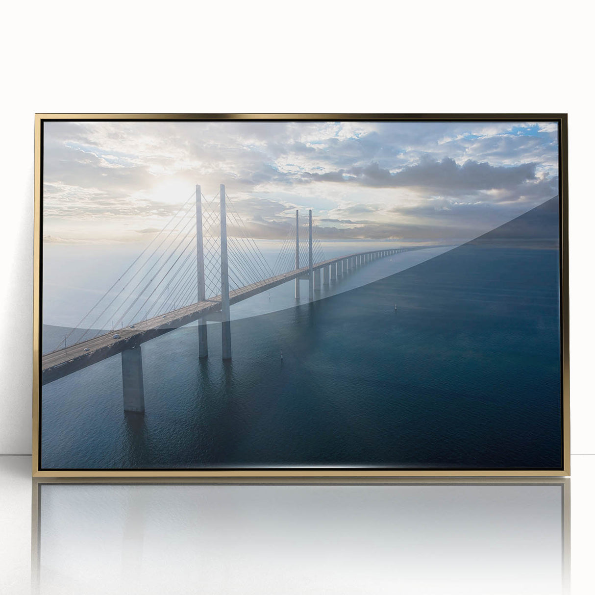 Framed acrylic wall art depicting a scenic landscape with a bridge, featuring vibrant colors and a gold frame, perfect for home decor. This elegant piece enhances any room's ambiance with its artistic charm and rich visual detail.